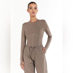 The Giving Movement Corset Long-Sleeve
Softskin100 Bodysuit. NWOT